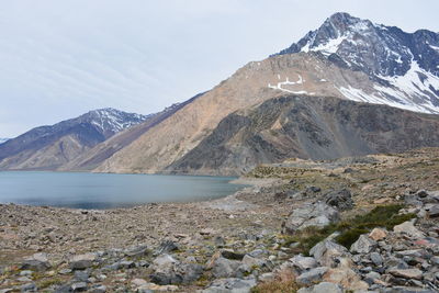 Scenic view of lake and mountains against sky