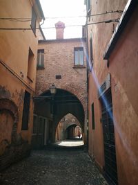 Narrow alley amidst buildings in city