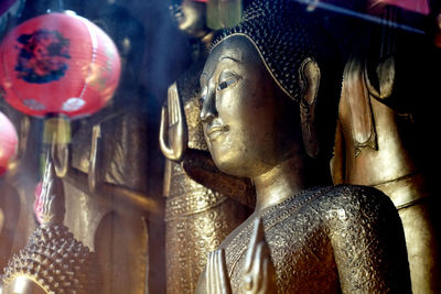 Close-up of buddha statue in temple