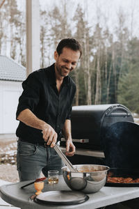 Man having barbecue