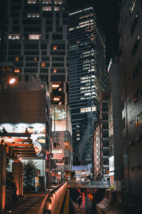 Illuminated buildings in city at night