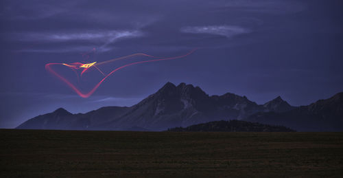 Scenic view of mountains against sky during sunset