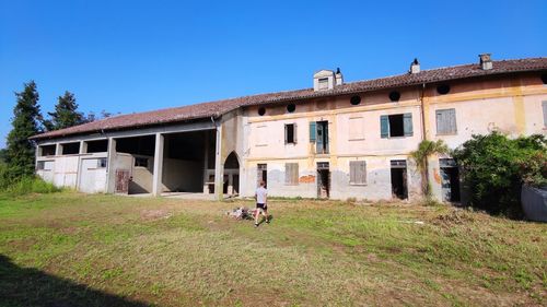 Buildings against clear blue sky