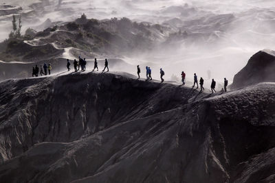 People on snowcapped mountain