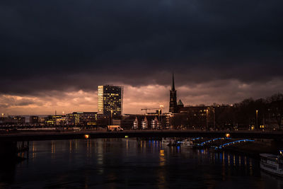 River with illuminated buildings in background