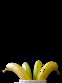 Close-up of fruit over black background