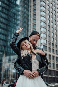 Young couple standing in city