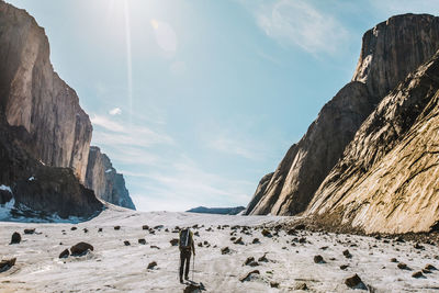 Rear view of explorer crossing the parade glacier, baffin island.