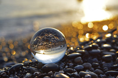 Close-up of crystal ball on stone