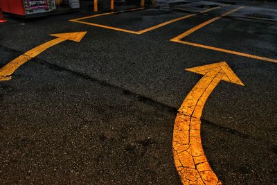 High angle view of arrow sign on road