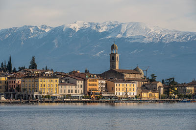 The beautiful lakeside of salò with the lake garda and the monte baldo in background