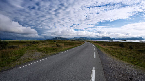 Road amidst landscape against sky