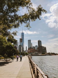 People in city against sky