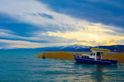 Boat in sea against sky