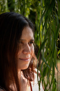 Close-up of young woman looking away
