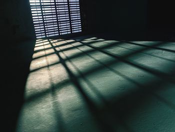 Shadow of sunlight falling on floor in building