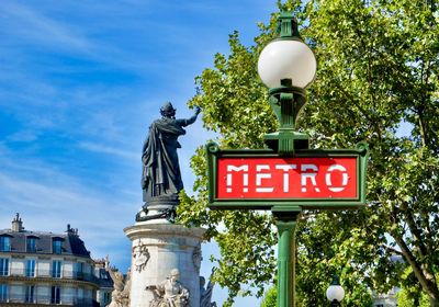 Metro - subway sign and statue at place de la republique