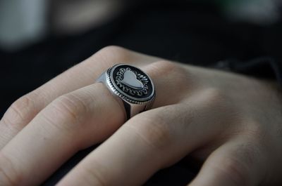 Close-up of hand holding ring