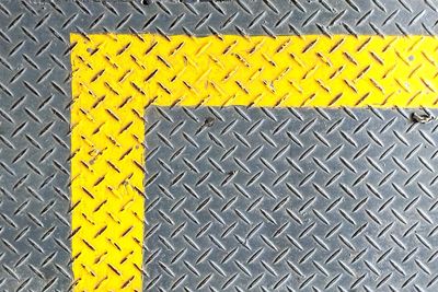 High angle view of yellow symbol on road