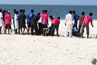 Rear view of people on beach