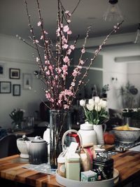 Flower vase on table at home