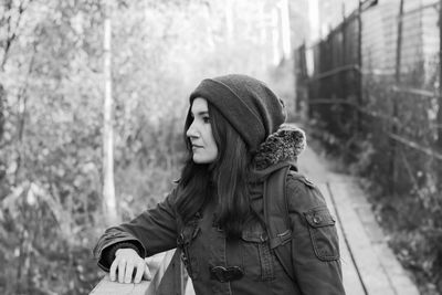 Young woman looking away outdoors