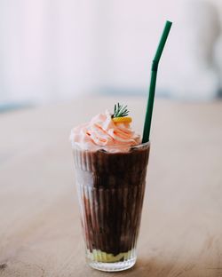 Close-up of hot chocolate with cream on table