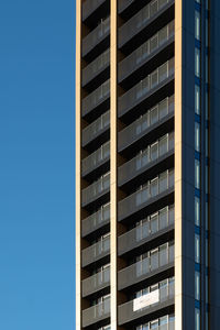 Low angle view of building against clear blue sky