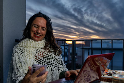 Young woman using mobile phone