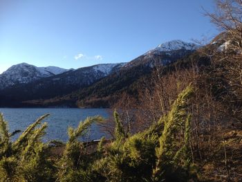 Scenic view of lake and mountains against sky