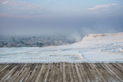 Scenic view of land against sky during winter