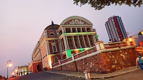 Low angle view of illuminated building against sky