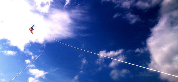 Low angle view of airplane flying in sky