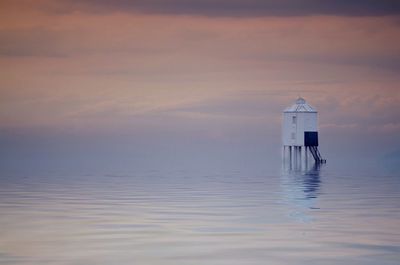 Scenic view of sea at sunset