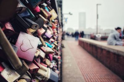 Close-up of padlocks on railing