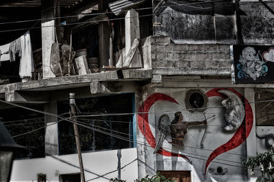 Low angle view of graffiti on old building