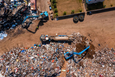 Old damaged cars on the junkyard waiting for recycling