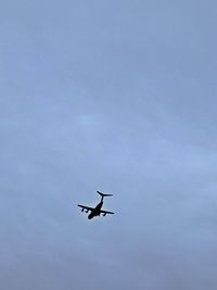 Low angle view of airplane flying in sky