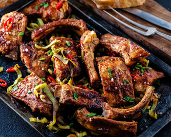 High angle view of meat on barbecue