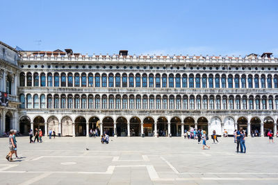 People at st mark square on sunny day