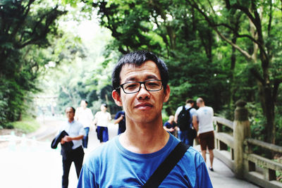 Portrait of young man standing outdoors