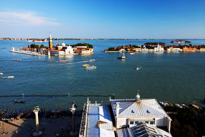 Mid distance view of san giorgio maggiore in grand canal against blue sky