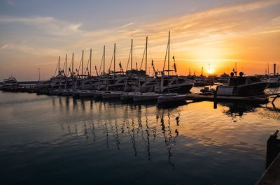 Boats moored at sunset