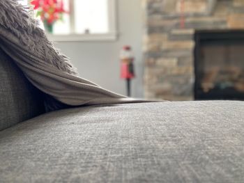 Close-up of woman sitting on floor