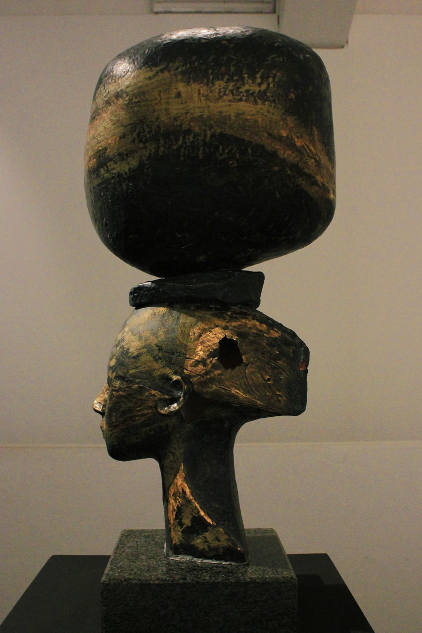 CLOSE-UP OF OLD SCULPTURE ON TABLE