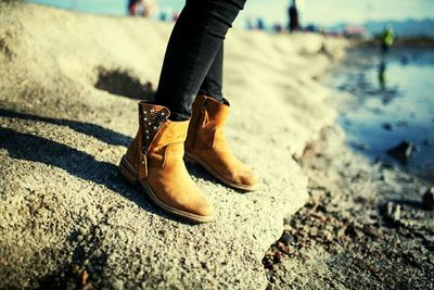 Low section of woman wearing boots