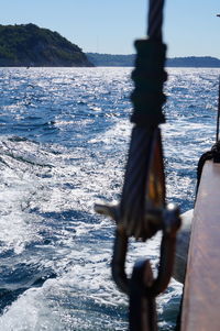 Close-up of nautical vessel on sea against sky