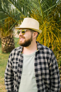 Portrait of young man wearing hat