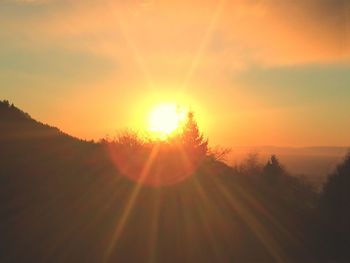 Scenic view of landscape against sky during sunset