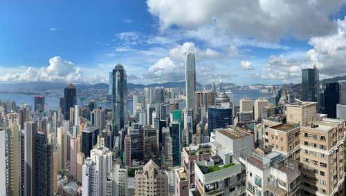 Panoramic view of modern buildings in city against sky